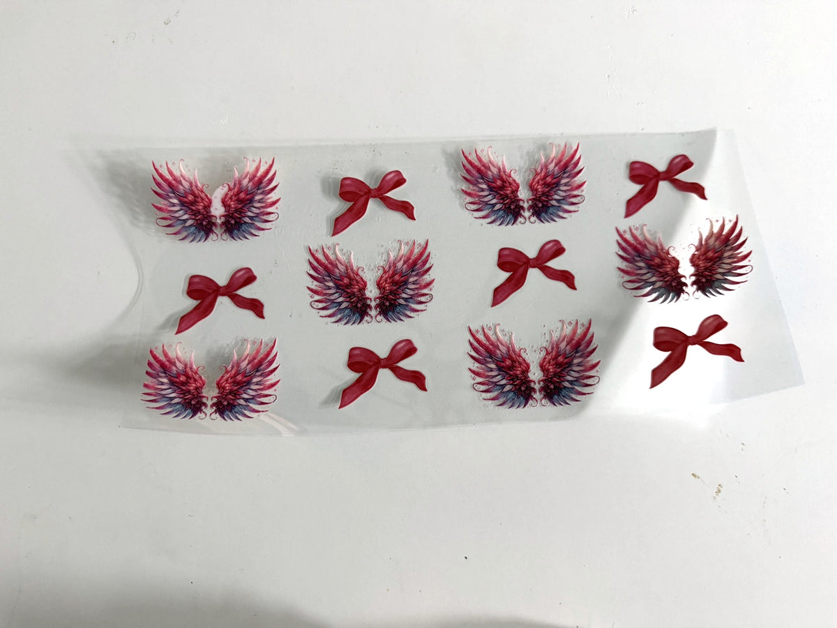 Pink Angel Wings & Bows UV DTF transfer sheet, upright view